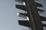 Close-up of sharp metal teeth on a cutting tool.