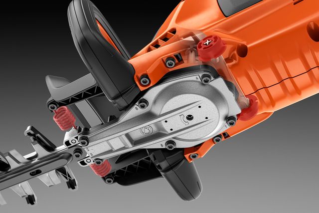 Close-up view of a hedge trimmer's blade and handle mechanism.