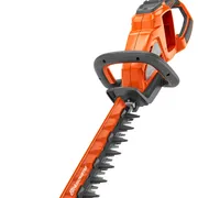 Side view of a Husqvarna hedge trimmer with a long cutting blade.