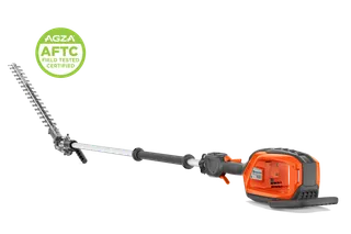 Studio side views of a Husqvarna pole hedge trimmer; one assembled, one with head detached.
