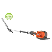 Studio side views of a Husqvarna pole hedge trimmer; one assembled, one with head detached.