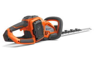Side view of a Husqvarna hedge trimmer showcasing its ergonomic handle and blade.