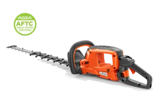 Studio side view of a hedge trimmer with long blade and rear handle; badge shows AGZA AFTC.
