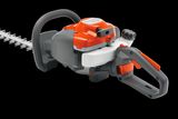 Side view of a hedge trimmer with ergonomic handle and dual-action blades.