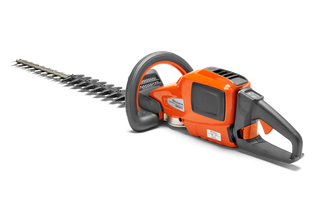 Side view of a Husqvarna hedge trimmer with ergonomic handle and blade.