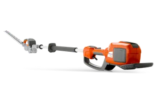 Side view of a Husqvarna battery-powered hedge trimmer with extended reach.