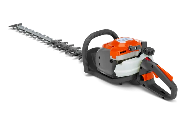 Side view of a hedge trimmer with ergonomic handle and long cutting blades.