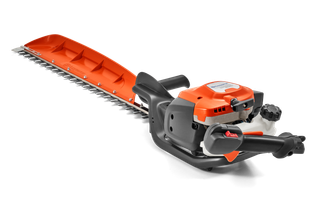 Side view of a hedge trimmer with ergonomic handle and cutting blades.