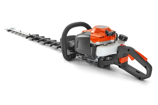 Side view of a hedge trimmer with ergonomic handle and cutting blade.
