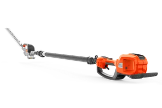Sidovy av en batteridriven Husqvarna-häcksax med utökad räckvidd.