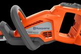 Side view of a Husqvarna Hedge Master hedge trimmer showcasing its ergonomic handle.