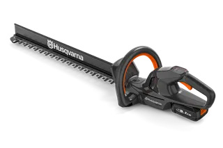 Side view of a Husqvarna hedge trimmer showcasing its ergonomic handle and cutting blade.