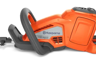 Side view of a Husqvarna hedge trimmer showcasing its ergonomic handle and blade.