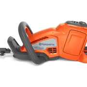 Side view of a Husqvarna hedge trimmer showcasing its ergonomic handle and blade.