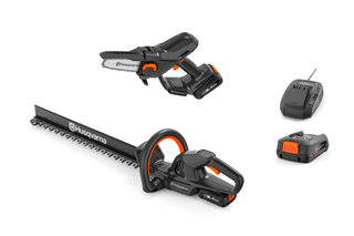 Studio image showing Husqvarna hedge trimmer, chainsaw, and battery charger.