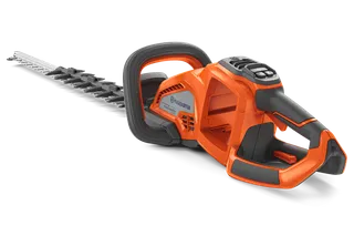 Side view of a Husqvarna hedge trimmer showcasing its ergonomic handle and cutting blades.