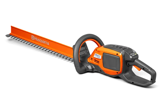 Side view of a Husqvarna hedge trimmer with a long cutting blade.
