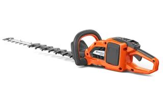 Vy från sidan av en Husqvarna häcksax med ergonomiskt handtag.