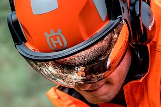 Close-up of a safety helmet with ear protection and visor.