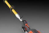 Close-up of a pole saw with adjustable settings, focusing on the control panel.
