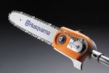 Close-up of a Husqvarna chainsaw blade and motor.