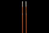 Two long poles with metallic ends, possibly for construction or gardening purposes.