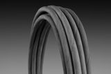 Close-up of coiled industrial hoses against a gradient background.