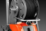 Front view of a hose reel mounted on a pressure washer.