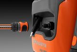 Close-up of a Husqvarna PW 360 pressure washer with a hose connector.