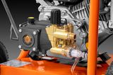 Close-up view of a pressure washer pump and engine components.