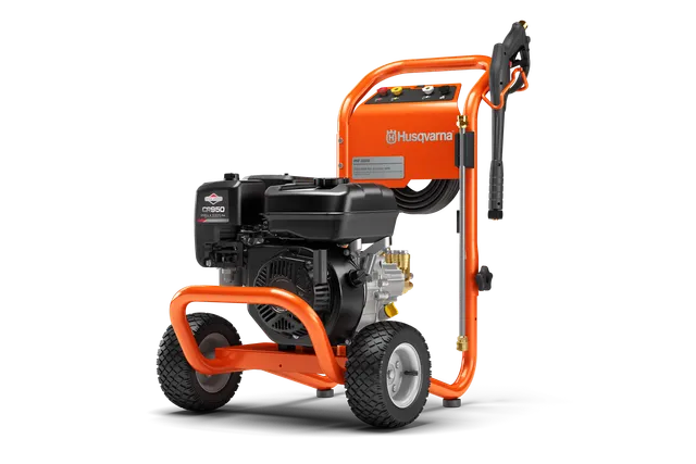 Side view of a Husqvarna pressure washer with a sturdy frame and wheels.