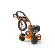 Side view of a construction pressure washer with hose and ergonomic handle.