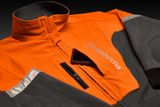 Front view of a Husqvarna work jacket with a smartphone in the chest pocket.