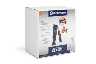 Box of Husqvarna Protective Power Kit Classic with helmet, gloves, and chaps illustrated on the packaging.
