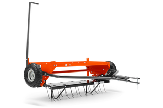 Side view of a garden dethatcher with wheels and metal tines.