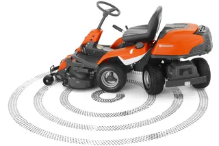 Side view of a Husqvarna ride-on mower with tire track patterns around it.