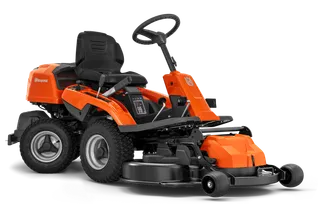 Front view of a ride-on mower with steering wheel and cutting deck.