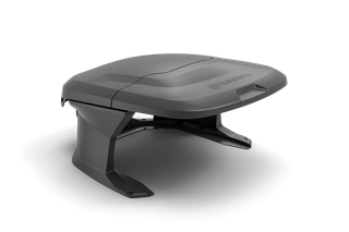 Side view of a robotic lawn mower with a sleek design.