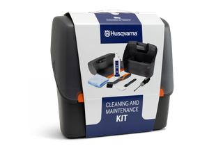 Front view of a Husqvarna cleaning and maintenance kit box, showing its contents.