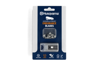 Front view studio image of Husqvarna Automower Endurance Blades retail pack showing 6 blades, safety blade and carbon steel icons, and certification symbols.