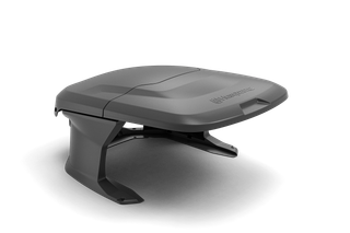 Side view of a Husqvarna robotic lawn mower house.