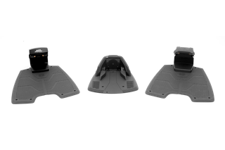 Top view of a robotic lawn mower charging station with docking pads.
