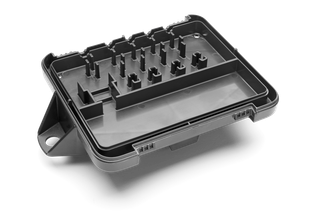 Top view of a plastic tray with multiple compartments and slots.