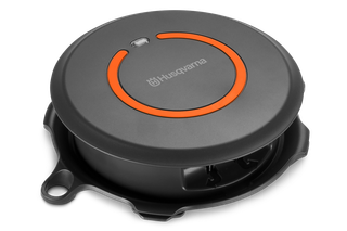 Top view of a Husqvarna robotic lawn mower charging station.