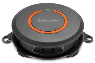 Top view of a Husqvarna robotic lawn mower charging station.