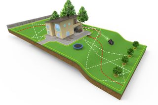 Illustration d’un aménagement de jardin avec une tondeuse à gazon robotisée fonctionnant sur une pelouse.