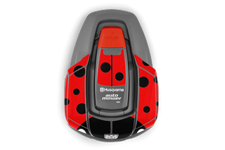 Top view of a Husqvarna Automower with a ladybug-themed design.
