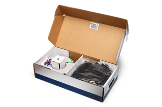 Top view of an opened box containing various installation accessories.