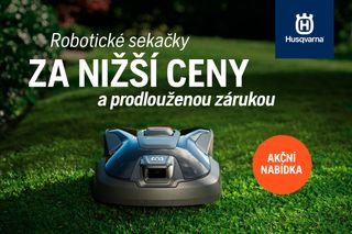 Husqvarna robotic mower on lawn; Czech promo: lower prices, extended warranty, 'AKČNÍ NABÍDKA'.