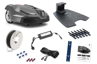 Husqvarna robotic lawn mower with accessories including charging station, boundary wire, and connectors.